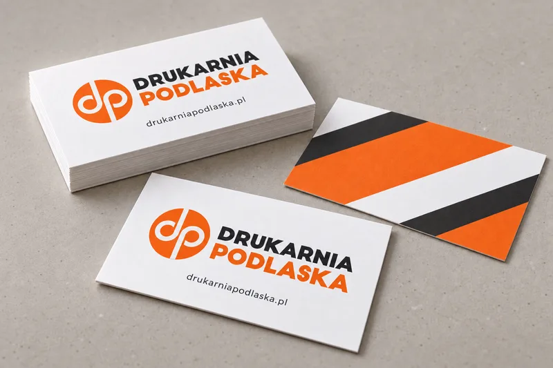 Pomarańczowe i grafitowe wizytówki Drukarni Podlaskiej — motyw wizualny sklepu